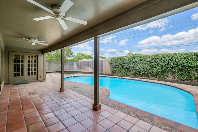 1319 E Brooklake Dr, Houston, TX 77077 - view of pool featuring a fenced in pool, french doors, a fenced backyard, a ceiling fan, and a patio area