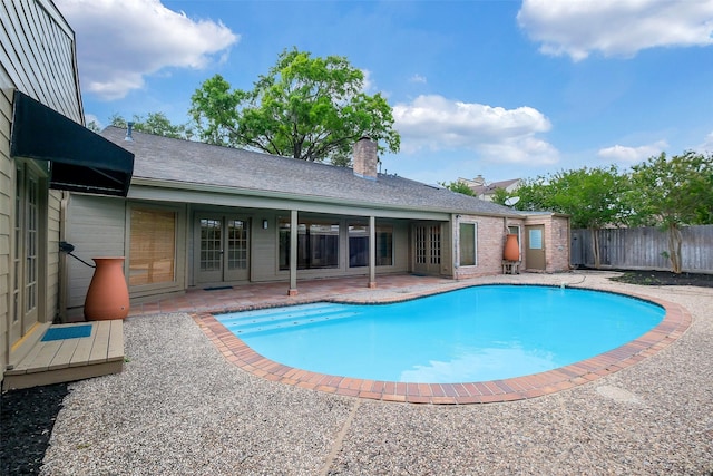 1319 E Brooklake Dr, Houston, TX 77077 - view of swimming pool featuring a fenced in pool, a patio, and fence