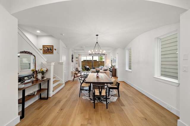 805 Fisher St Unit B, Houston, TX 77018 - dining area featuring a chandelier, stairs, light wood finished floors, baseboards, and vaulted ceiling