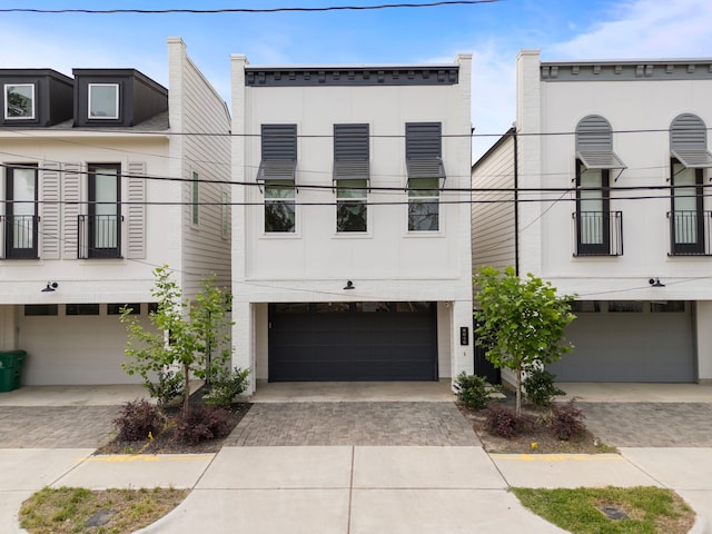 805 Fisher St Unit B, Houston, TX 77018 - view of front of house featuring a garage and decorative driveway