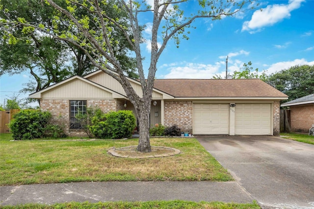 ranch-style home with aphalt driveway, brick siding, a front yard, and a garage