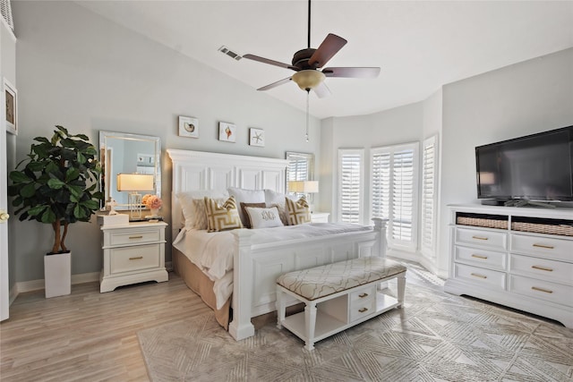 459 Mariners Dr, Kemah, TX 77565 - bedroom featuring lofted ceiling, baseboards, light wood-style floors, and ceiling fan