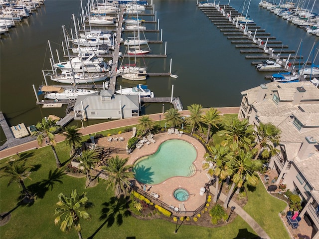 459 Mariners Dr, Kemah, TX 77565 - bird's eye view of numerous boat docks, a nearby body of water, and a pool area