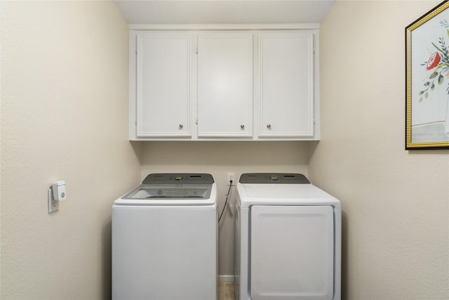 2104 Olympic Dr, League City, TX 77573 - clothes washing area with cabinet space and independent washer and dryer