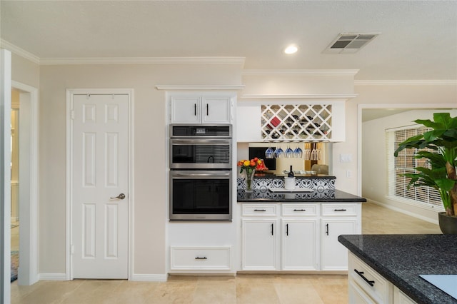 2104 Olympic Dr, League City, TX 77573 - kitchen featuring visible vents, white cabinetry, stainless steel double oven, and ornamental molding