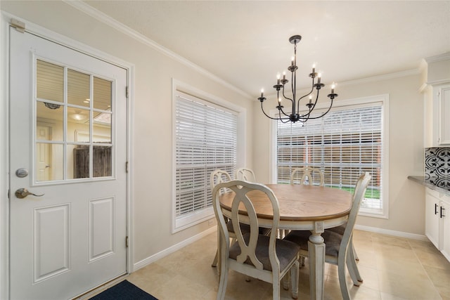 2104 Olympic Dr, League City, TX 77573 - dining room with light tile patterned floors, an inviting chandelier, ornamental molding, and baseboards