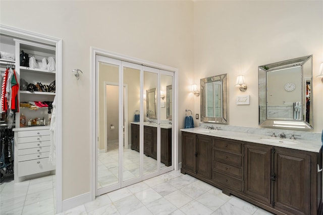 2104 Olympic Dr, League City, TX 77573 - full bathroom featuring marble finish floor, a towering ceiling, and a sink