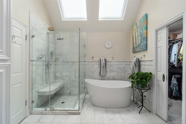 2104 Olympic Dr, League City, TX 77573 - bathroom featuring a shower stall, lofted ceiling, a freestanding tub, and a walk in closet