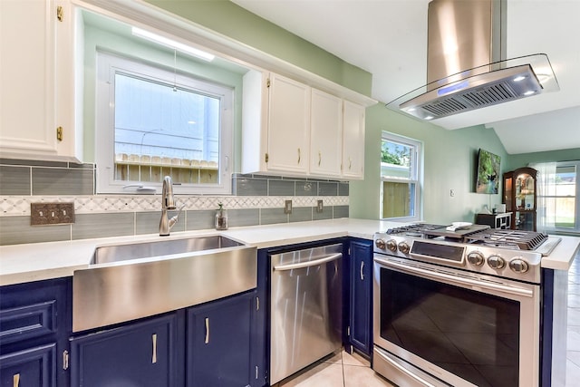 kitchen featuring blue cabinets, stainless steel appliances, white cabinets, a sink, and island range hood