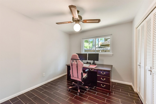 office area featuring wood finish floors, baseboards, and ceiling fan