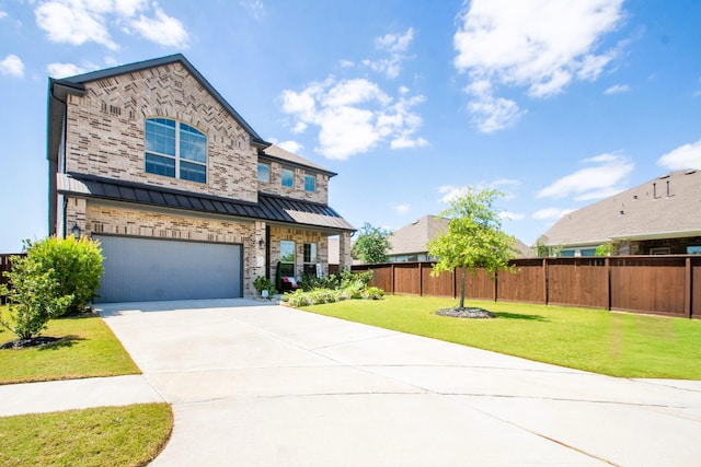 10110 Stride Ct, Iowa Colony, TX 77583 - view of front facade featuring fence, concrete driveway, an attached garage, a standing seam roof, and a front yard