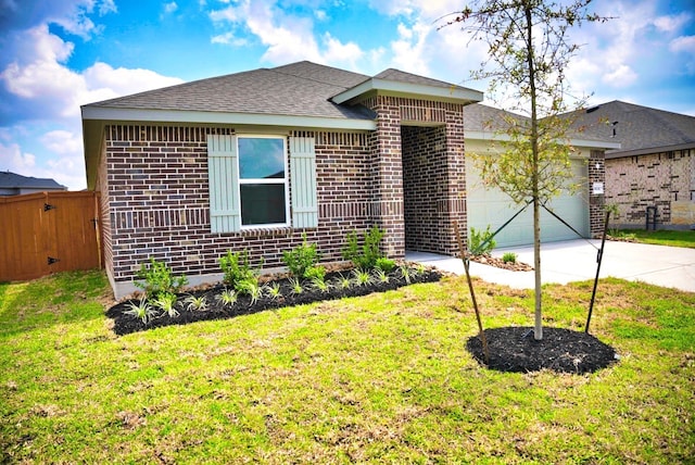 single story home featuring driveway, fence, brick siding, an attached garage, and a front yard