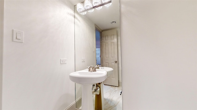 bathroom featuring marble finish floor, baseboards, and visible vents