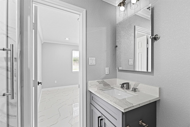 bathroom featuring a textured wall, marble finish floor, vanity, and crown molding