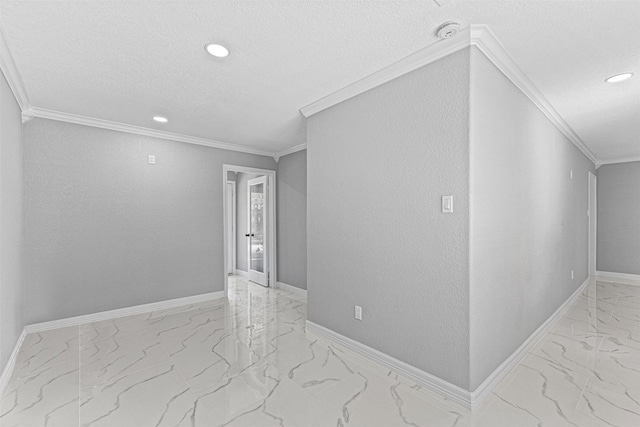 unfurnished room featuring recessed lighting, a textured ceiling, marble finish floor, and ornamental molding