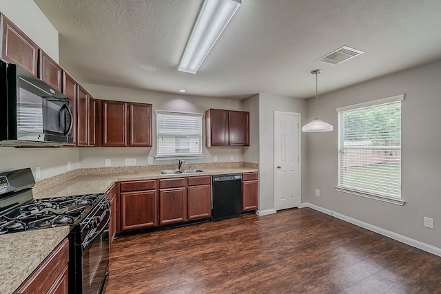 21423 Palma Grove Way, Houston, TX 77073 - kitchen with a sink, black appliances, light countertops, dark wood-style flooring, and visible vents