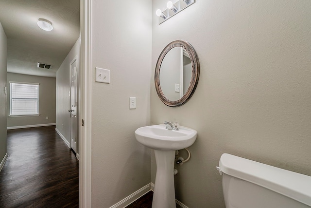 21423 Palma Grove Way, Houston, TX 77073 - bathroom with wood finished floors, visible vents, toilet, and baseboards