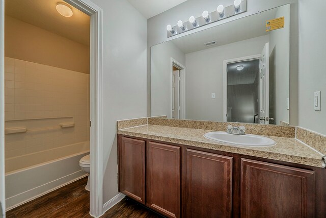21423 Palma Grove Way, Houston, TX 77073 - full bathroom with wood finished floors, visible vents, shower / bath combination, toilet, and vanity
