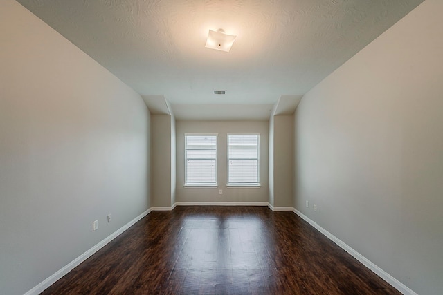 21423 Palma Grove Way, Houston, TX 77073 - spare room with baseboards, visible vents, and dark wood-style floors