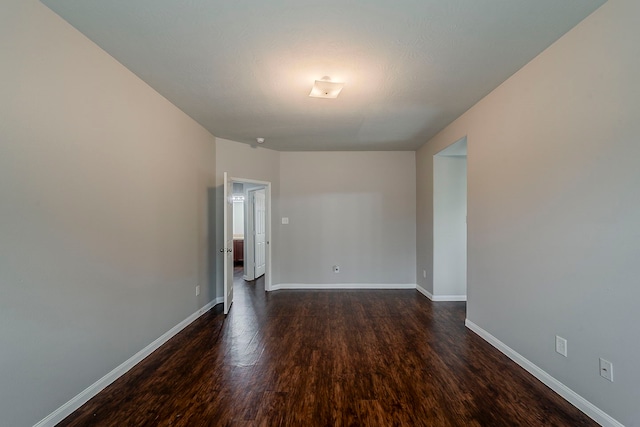 21423 Palma Grove Way, Houston, TX 77073 - spare room with baseboards and dark wood-type flooring