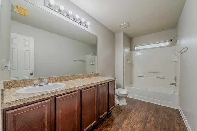 21423 Palma Grove Way, Houston, TX 77073 - full bath featuring toilet, shower / bathing tub combination, visible vents, wood finished floors, and vanity