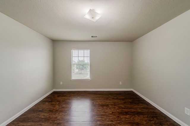 21423 Palma Grove Way, Houston, TX 77073 - empty room with baseboards, dark wood-style flooring, and visible vents
