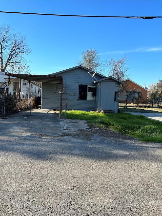 2406 Delano St, Houston, TX 77004 - view of front of home featuring aphalt driveway and an attached carport