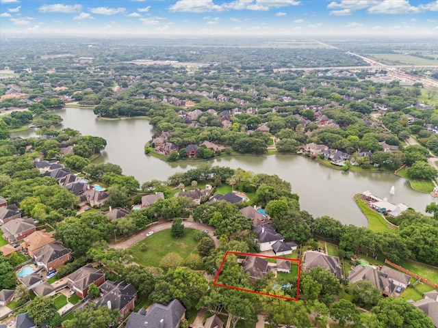 birds eye view of property featuring a residential view and a water view