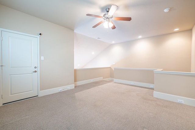 empty room with lofted ceiling, carpet, recessed lighting, and ceiling fan