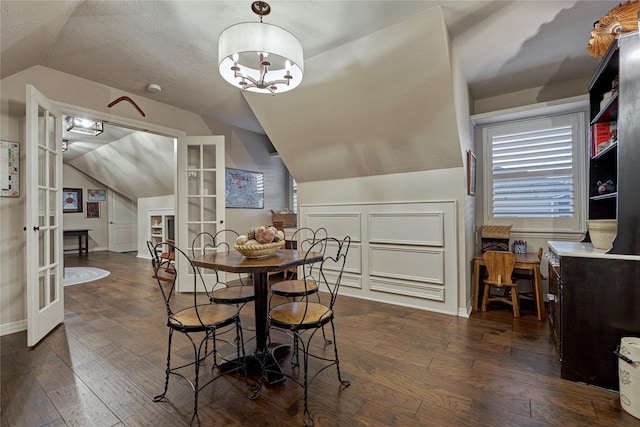 26 Greenview St, Montgomery, TX 77356 - dining room featuring vaulted ceiling, french doors, dark wood-type flooring, and baseboards