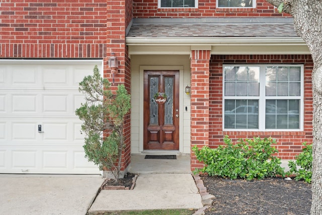 property entrance featuring brick siding