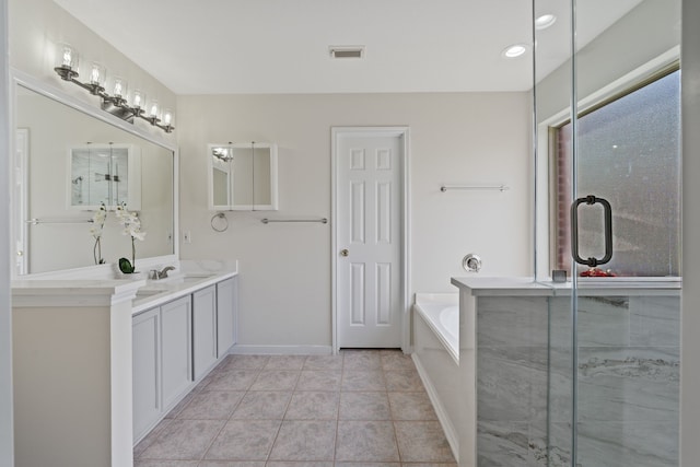 full bathroom featuring a bath, vanity, visible vents, and a stall shower