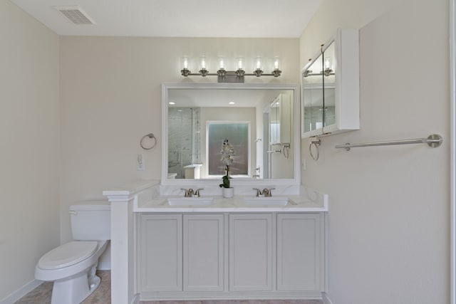 full bath featuring toilet, a sink, visible vents, and a stall shower