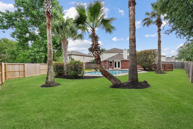 view of yard with a fenced backyard and a fenced in pool