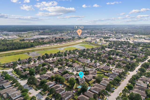 drone / aerial view with a water view and a residential view