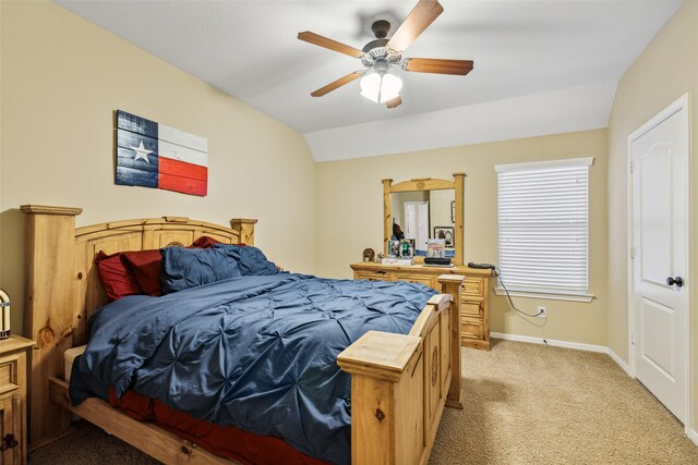 bedroom with a ceiling fan, light carpet, lofted ceiling, and baseboards