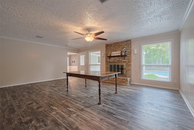 game room with wood finished floors, a ceiling fan, a brick fireplace, a textured ceiling, and baseboards