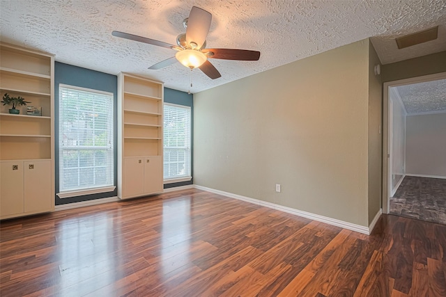 8326 Partlow Ln, Houston, TX 77040 - empty room featuring a textured ceiling, baseboards, wood finished floors, and ceiling fan