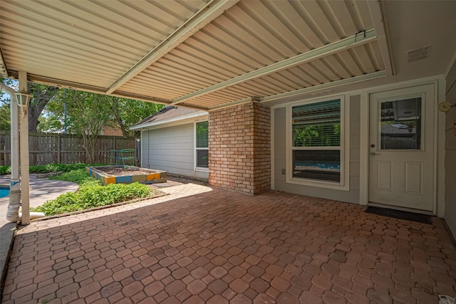 view of patio featuring fence