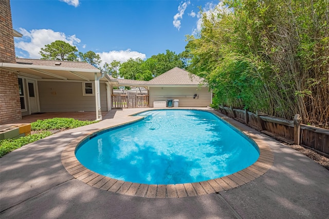 view of pool featuring a patio area and a fenced backyard