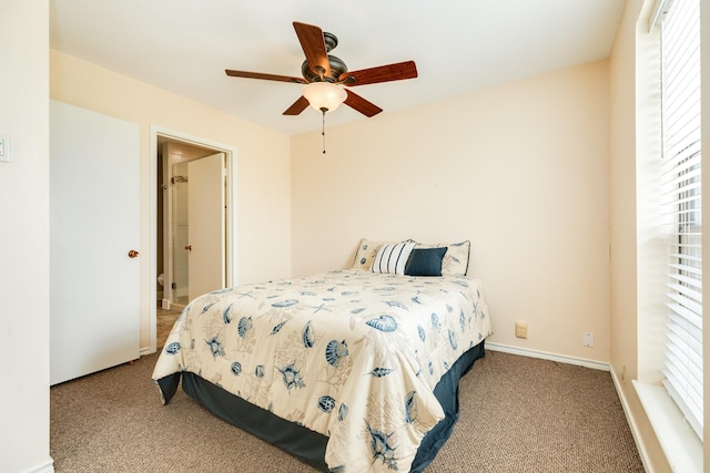 carpeted bedroom featuring a ceiling fan and baseboards