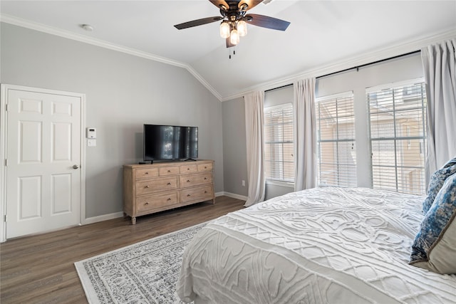 bedroom with baseboards, lofted ceiling, a ceiling fan, wood finished floors, and ornamental molding
