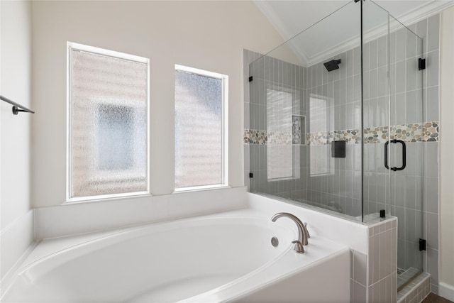 full bath featuring lofted ceiling, a garden tub, a shower stall, and ornamental molding