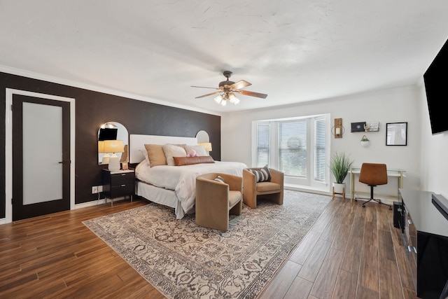 310 Yorkshire Ln, Port Neches, TX 77651 - bedroom with dark wood finished floors, crown molding, baseboards, and a ceiling fan