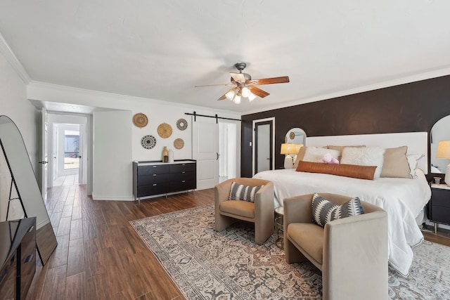 310 Yorkshire Ln, Port Neches, TX 77651 - bedroom with a barn door, wood finished floors, ceiling fan, and ornamental molding