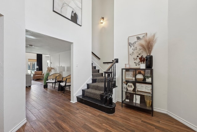 310 Yorkshire Ln, Port Neches, TX 77651 - stairway with baseboards, wood finished floors, and a towering ceiling