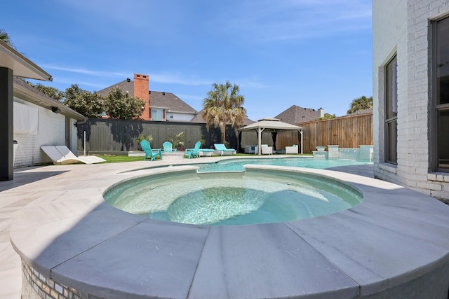 310 Yorkshire Ln, Port Neches, TX 77651 - view of swimming pool featuring a gazebo, a patio area, a fenced backyard, a fenced in pool, and an in ground hot tub