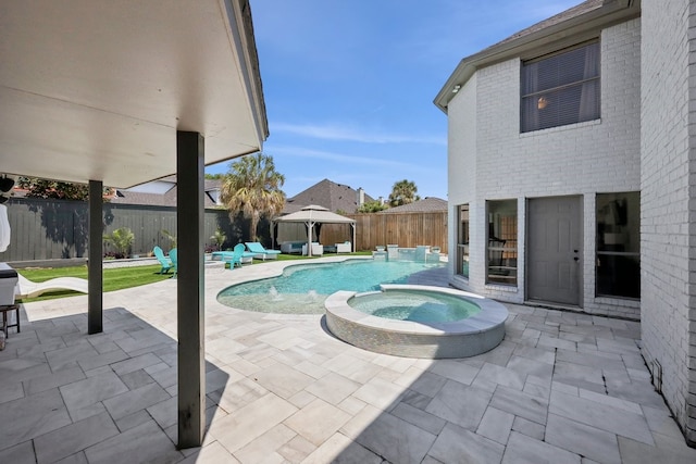 310 Yorkshire Ln, Port Neches, TX 77651 - view of swimming pool with a fenced backyard, a gazebo, a patio area, an outdoor hangout area, and a pool with connected hot tub