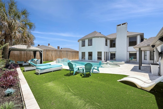 310 Yorkshire Ln, Port Neches, TX 77651 - rear view of house featuring a fenced backyard, a yard, a patio area, an outdoor living space, and a gazebo