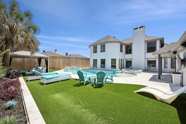 310 Yorkshire Ln, Port Neches, TX 77651 - back of house featuring a fenced backyard, a gazebo, outdoor lounge area, a patio area, and a lawn